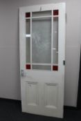 An early 20th century painted interior door with glass panels