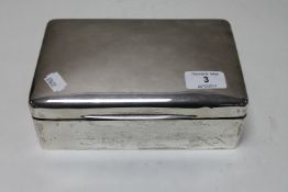 A silver cigarette box,