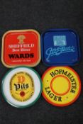 Nine 20th century tin pub trays bearing advertisement