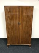 A 20th century inlaid mahogany double door gent's wardrobe