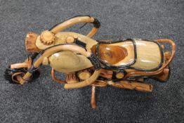 A hand built wooden model of a vintage motorcycle