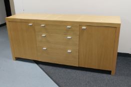 A contemporary oak veneered sideboard