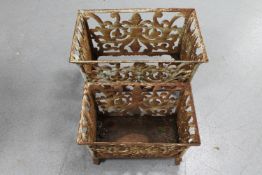 Two graduated cast iron garden planters