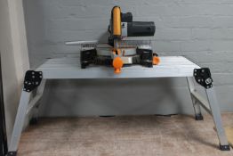 An Evolution sliding compound mitre saw on a folding aluminium stand