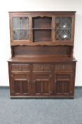 A carved oak triple door Welsh dresser
