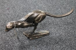 A cast iron figure of a cheetah