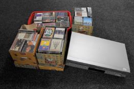 A Toshiba DVD / VCR with remote and four boxes and crate of audio cassette tapes