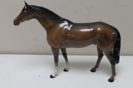 A large Beswick figure of a horse in brown gloss