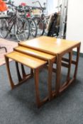 A nest of three mid 20th century teak G Plan tables