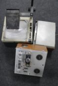 An HMJ overhead projector together with two vintage reel to reel players