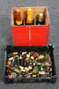 A basket of a quantity of alcohol miniatures together with a further crate containing a 50th