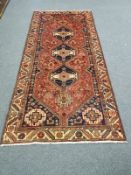 A Khamseh rug 277 cm x 127 cm
