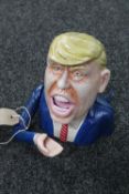 A cast iron novelty Donald Trump money box