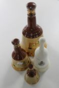 Three Bells Whisky decanters and one other