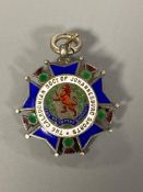 A silver and enamel medal for the Caledonian society of Johannesburg