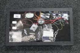 A display box containing costume jewellery, some sterling silver etc.