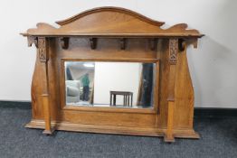 An Arts & Crafts oak sideboard mirror back