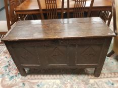 A George III panelled oak coffer,