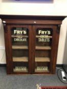 A Victorian mahogany bookcase top with later Fry's Chocolate advertising,