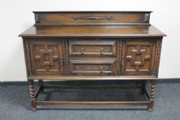 An Edwardian oak sideboard