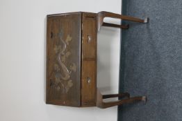 An oriental style hardwood carved bureau