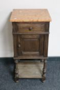 An Edwardian oak marble topped pot cupboard
