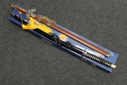A boxed Chinese style sword and one other sword