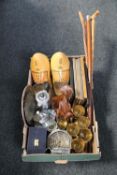 A box of plated wares, wooden clogs, picture frames, tribal hardwood figure,