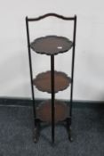 A folding mahogany cake stand