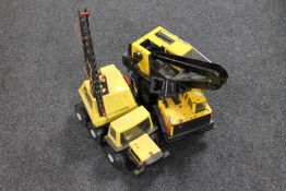 Two Tonka cranes