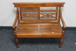 A carved hardwood child's bench