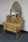 An Edwardian light oak mirrored dressing table