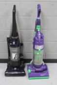 A Dyson DC4 vacuum together with a Samsung vacuum