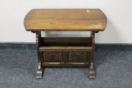 An oak Old Charm magazine table