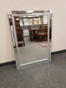A contemporary glass framed mirror,