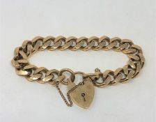 A heavy 9ct gold padlock bracelet CONDITION REPORT: 48.