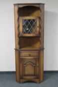 An oak corner cupboard
