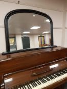 A black framed overmantel mirror, width 120 cm.