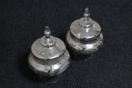 A pair of contemporary glass lidded bowls