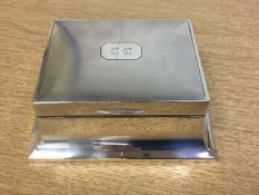 A good quality silver cigarette box, Walker & Hall, Sheffield 1929, width 13.