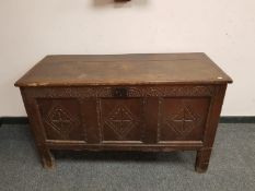 A George III panelled oak coffer,