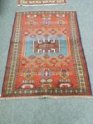 A Caucasian rug on red ground,