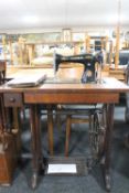 A mid twentieth century Singer treadle sewing machine