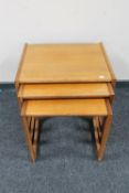 A nest of three teak G Plan tables