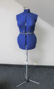 An adjustable dress maker's dummy on stand
