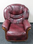 A Burgundy leather armchair
