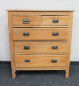An Edwardian pine five drawer chest