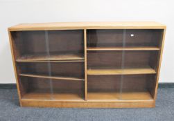 A set of mid 20th century sliding glass door bookshelves