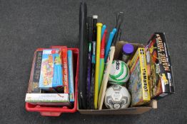 A box and crate of board games, cricket bats,