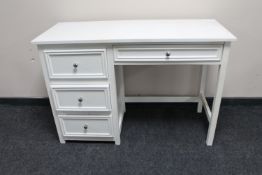 A contemporary four drawer dressing table